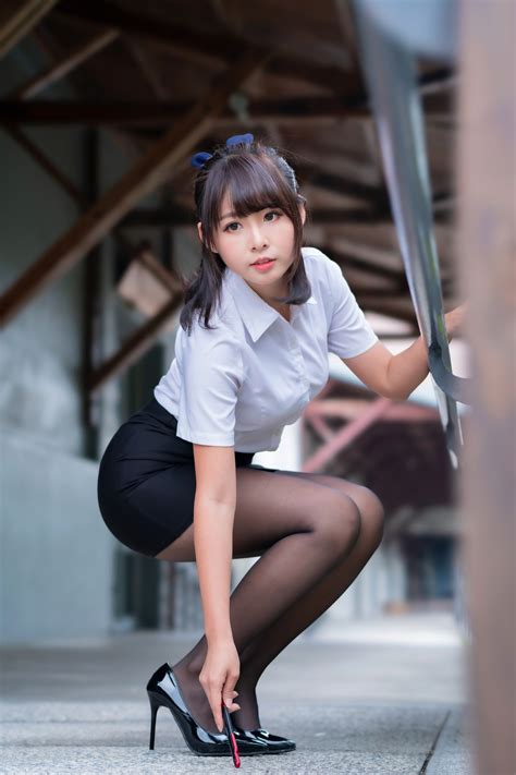 Asian Pose Brunette Girl Skirt Blouse Pantyhose Stilettos Bokeh