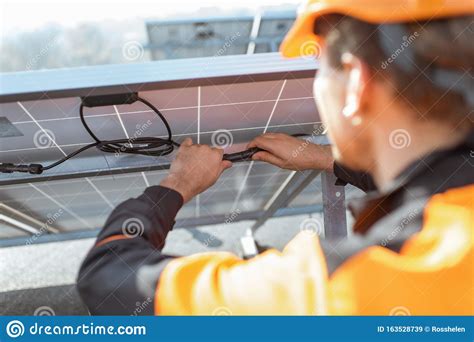 electrician connecting solar panels stock image image  station professional
