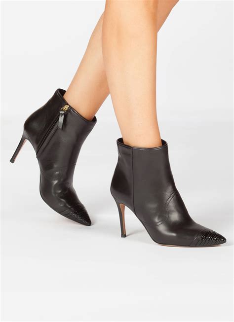 black high heel ankle boots with a patent pointy toe pura lopez