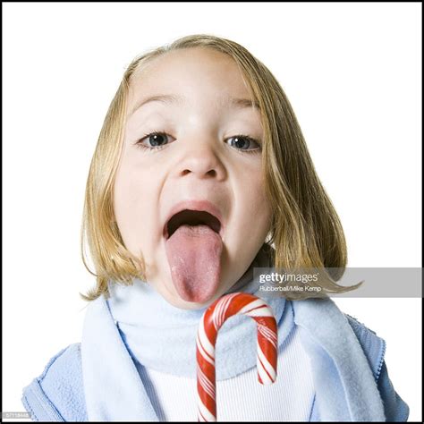 portrait of a girl sticking her tongue out photo getty images