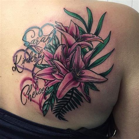 lovely and colorful lilies tattoo design for women shoulder blade