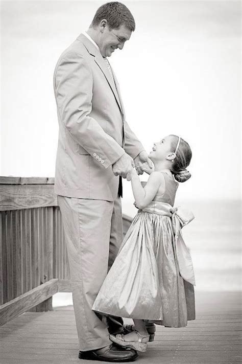 cute daughter dancing with daddy