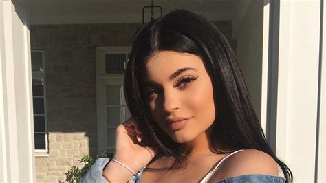 Kylie Jenner Wore A Nude Colored Dress And Green Thigh High Boots On