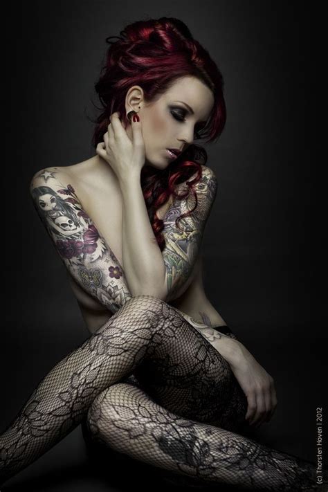 legs crossed stockings tattoos looking down to the side