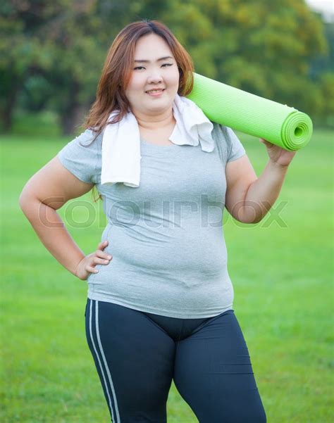Pretty Fat Asian Woman Going To Work Out With Her Yoga Mat