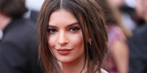 emily ratajkowski seemingly comes out as bi over a green velvet couch