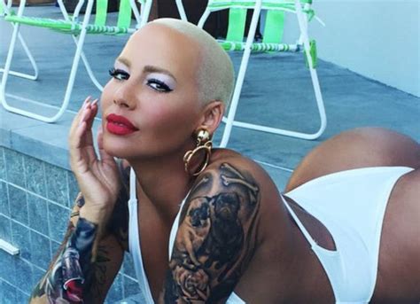 amber rose poses in sexy white bathing suit in new instagram pics