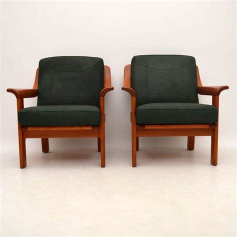 pair of danish retro teak and leather armchairs vintage 1970 s