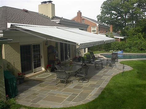 comparing  patio awning patio awning  retractable awnings side  side   stone patio