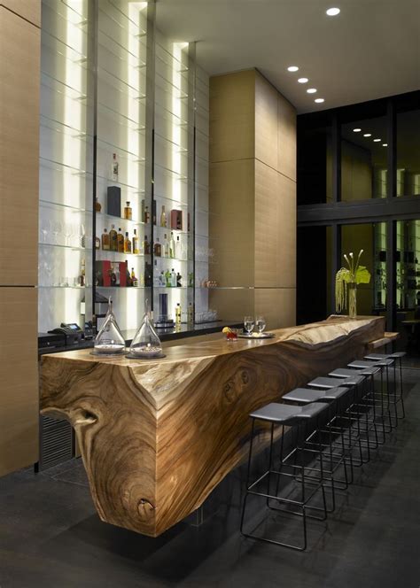 award winning custom designed tree trunk bar   porsche design tower modern home bar