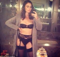 nicole trunfio covers up her famous cleavage in fluffy
