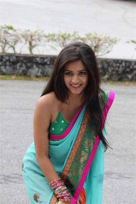 kriti kharbanda cute stills in orange saree tollywood stars