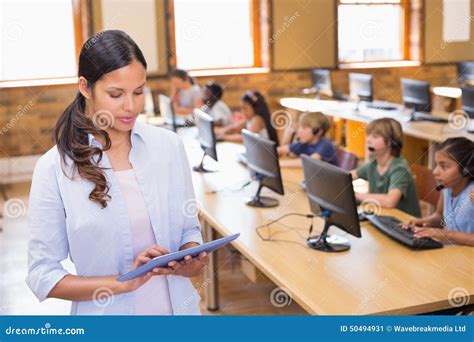 pretty teacher  tablet computer  computer class stock image image  education happy