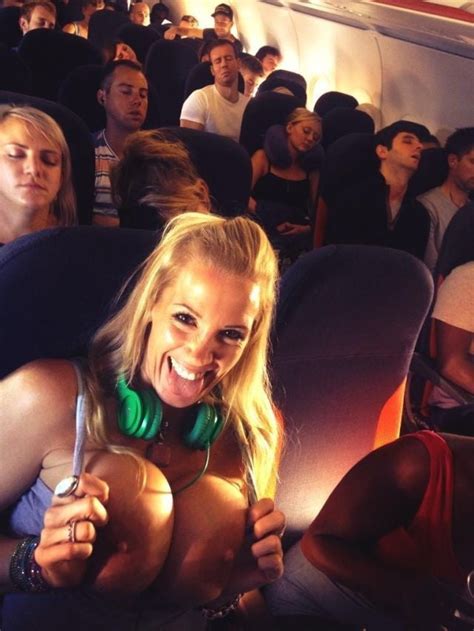 sexy blonde flashing great boobs on an airplane boobdude