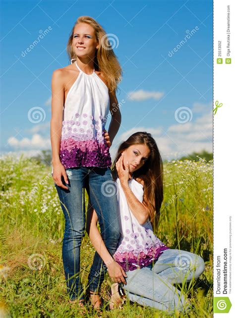 Two Happy Women Having Fun Posing And Enjoying Sun Stock