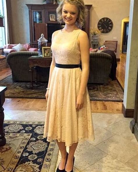 high school girl forced to wear coat over dress at dance because it was