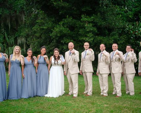 bridal party poses in bandages after bride breaks wrist