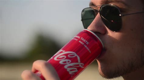 young person enjoys coca cola opens metal stock footage sbv  storyblocks