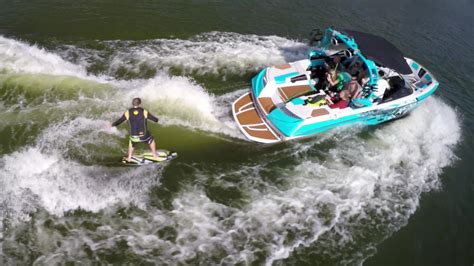 aerial shot   man wakeboard wake surfing   boat   lake  stock video  vecteezy