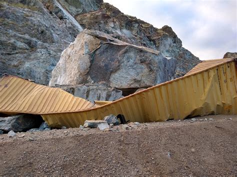 highway   closed  monitoring efforts continue  rockslide