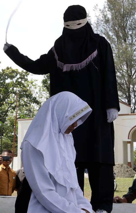 sharia law punishment adulterers publicly whipped in indonesia