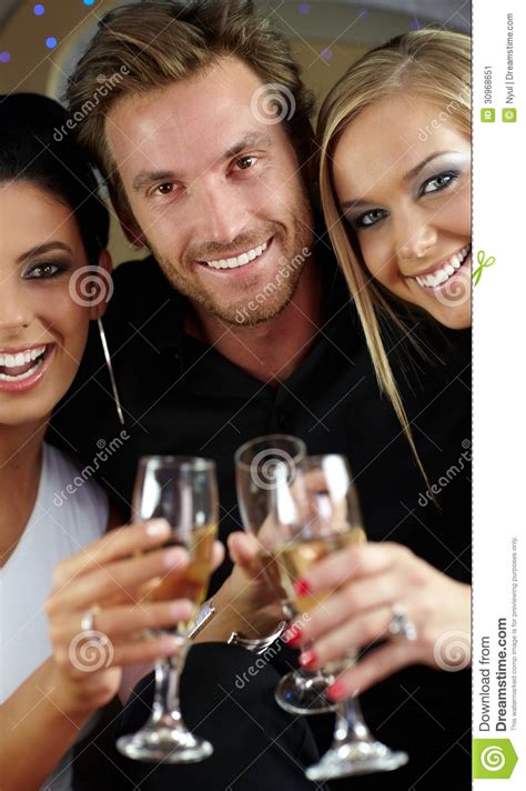 Beautiful People Clinking Glasses Smiling Stock Image