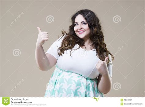 Happy Plus Size Fashion Model Fat Woman On Beige Background Stock