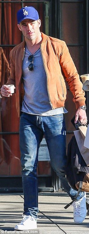 Chris Pine Flashes Smile While Donning Beige Coat T Shirt And Jeans