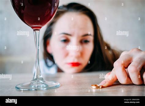 A Drunk Girl With A Glass Of Wine Is Sad Because Of A Divorce From Her