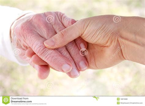 Senior Woman S Hand And Helping Hand Royalty Free Stock