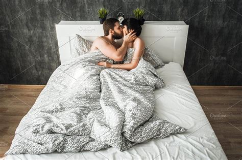 Couple In Love Kissing In Bed Containing Bed Two And Attractive