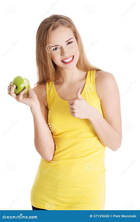 Beautiful Causal Caucasian Woman Holding Fresh Green Apple With Stock