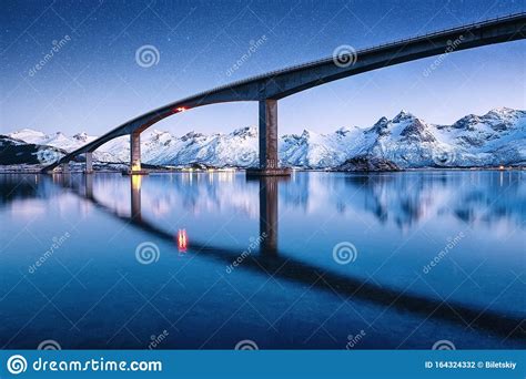 Bridge Water And Night Sky With Stars Reflection On The