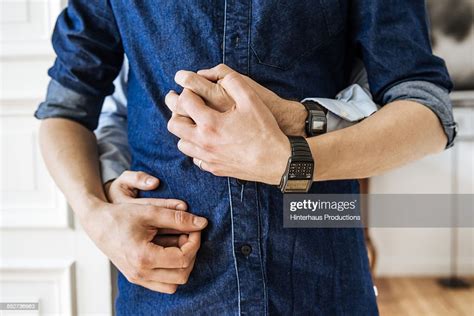 Gay Couple Hugging And Holding Hands Photo Getty Images