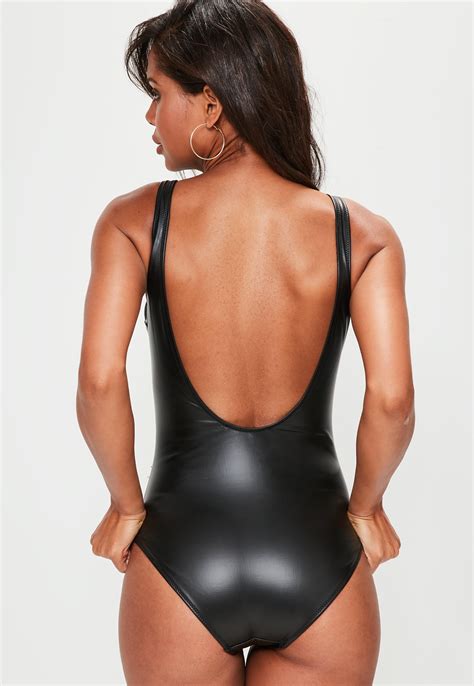 zip it like it s hot with this black wet look swimsuit with a front zip