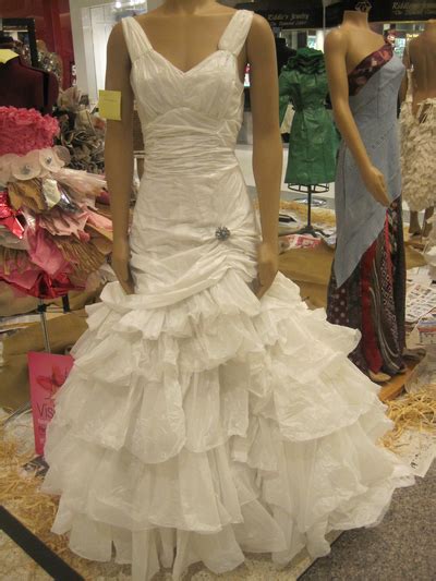 even though this wedding dress is made out of plastic garbage bags it looks like a million