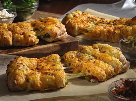 dominos pizza introduces redeveloped cheesy bread