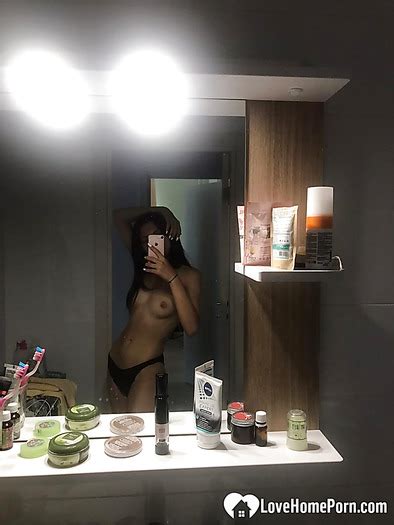 Hot College Girl Reveals Her Tits In The Mirror