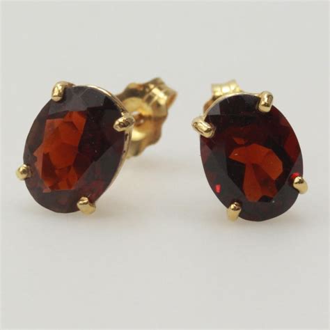 kt gold  red stone stud earrings property room