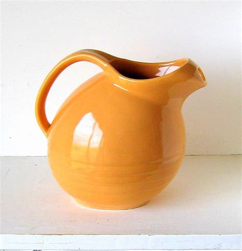 vintage usa pottery orange pitcher  marcrest
