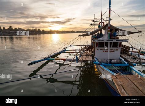 philippinespalawanroxaspig   boat  sunrise stock photo alamy