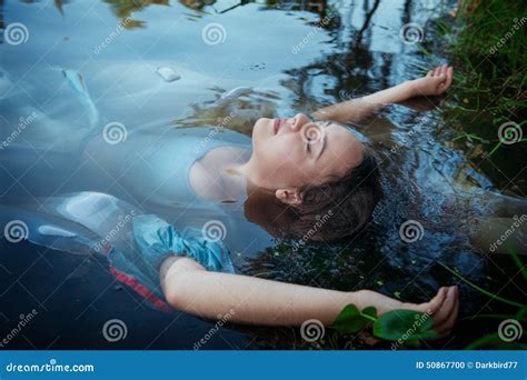 young beautiful drowned woman  blue dress lying   river stock photo image  long