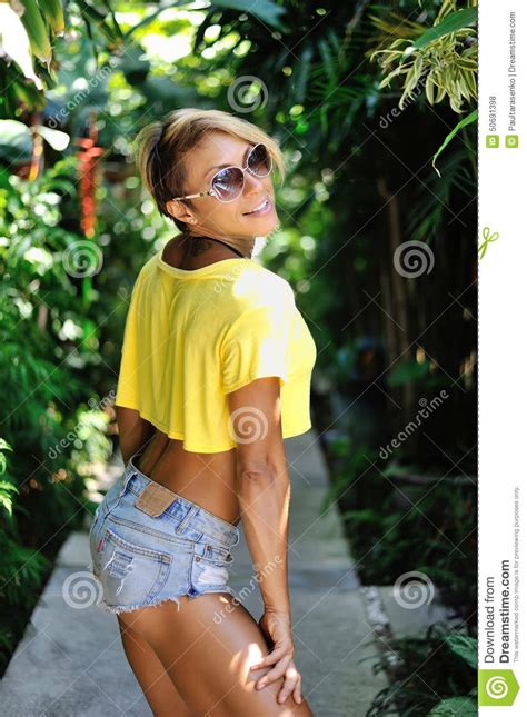 beautiful blonde woman posing outdoor tan and slim girl