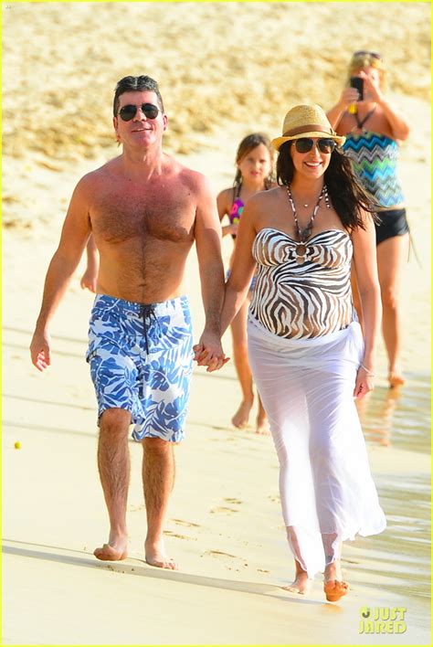 simon cowell and lauren silverman hold hands on new year s eve photo