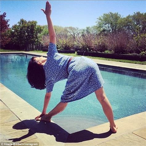 hilaria baldwin tries a relaxing yoga pose by the pool daily mail online