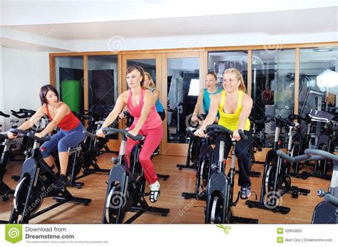 Beautiful Woman Doing Exercise In A Spinning Class Stock
