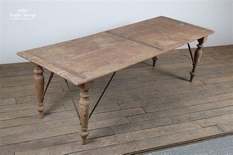 salvaged long   rustic wooden table
