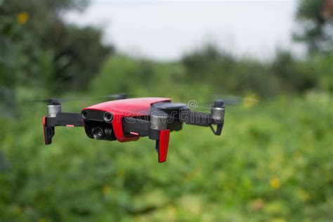 red drone hovering   air stock image image  background aerial