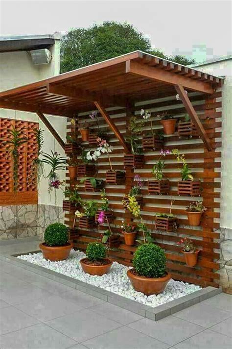 home green wall plants hanging  wooden panels  terrace