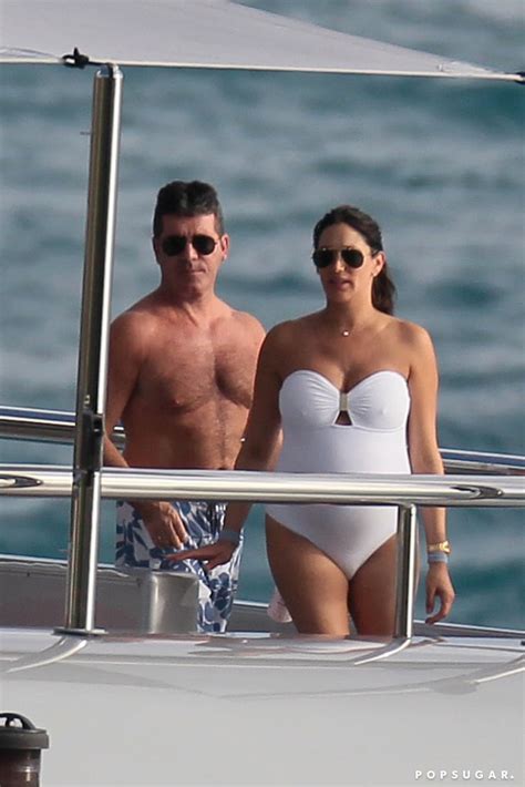 the couple enjoyed the sunshine shirtless simon cowell and pregnant lauren silverman